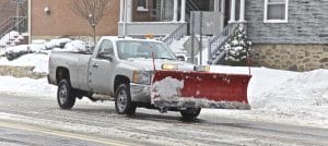 Truck with plow, Cleaning an icy road